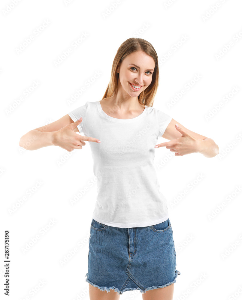Woman pointing at her t-shirt against white background Woman pointing at her t-shirt against white background