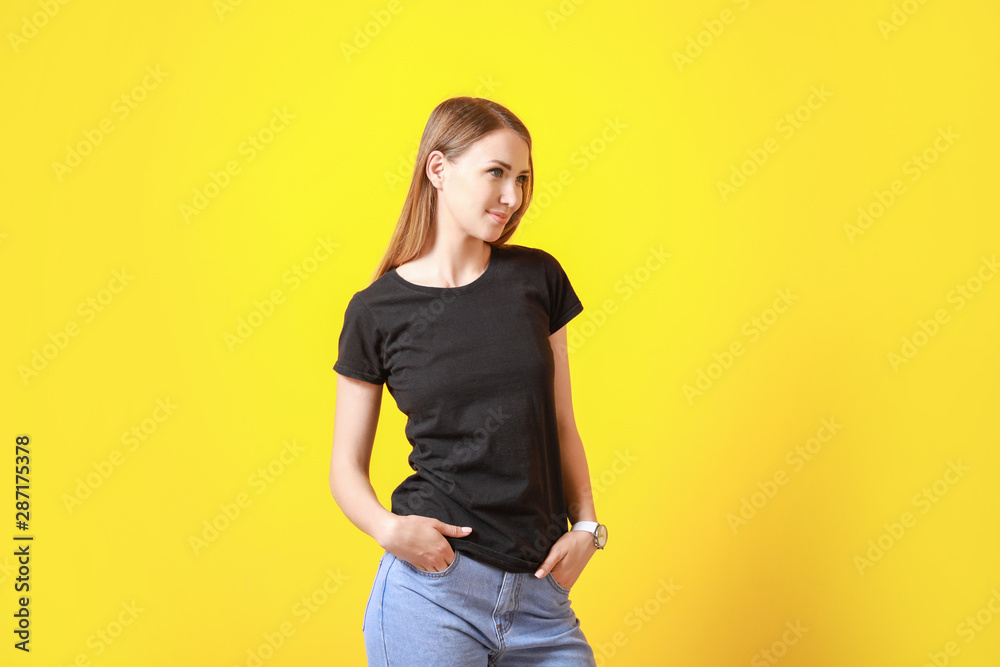 Woman in stylish t-shirt on color background