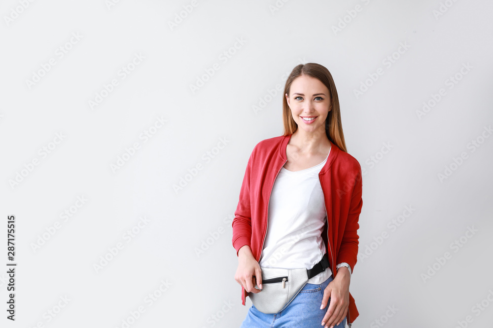 Woman in stylish t-shirt on light background Woman in stylish t-shirt on light background