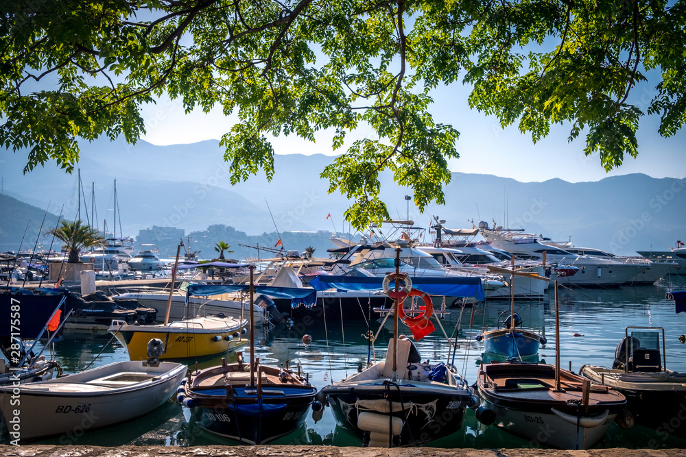 boats at the pier of the old town of Budva