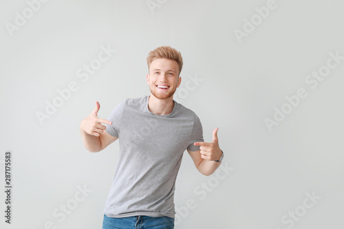 Man pointing at his t-shirt...