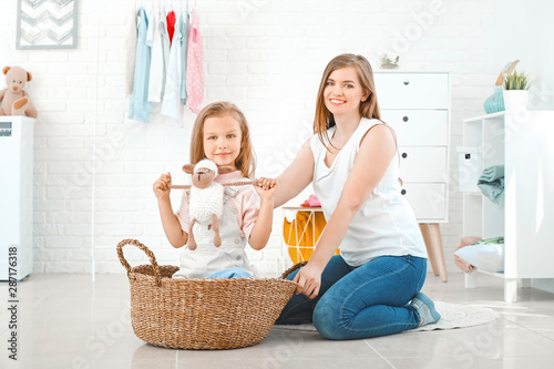 Woman and her little daught...