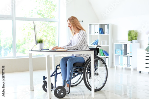 Handicapped woman working in office
