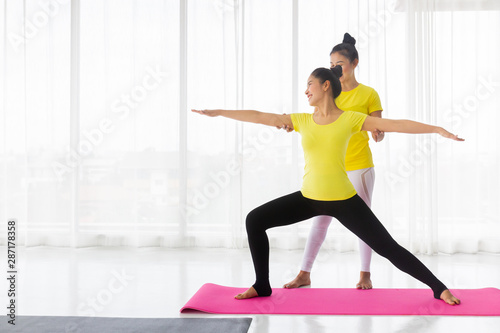 Yoga teachers are teaching exercise yoga for students. With the correct position Inside the room for good health and flexibility of the muscles It is a lifestyle activity healthy for everybody.