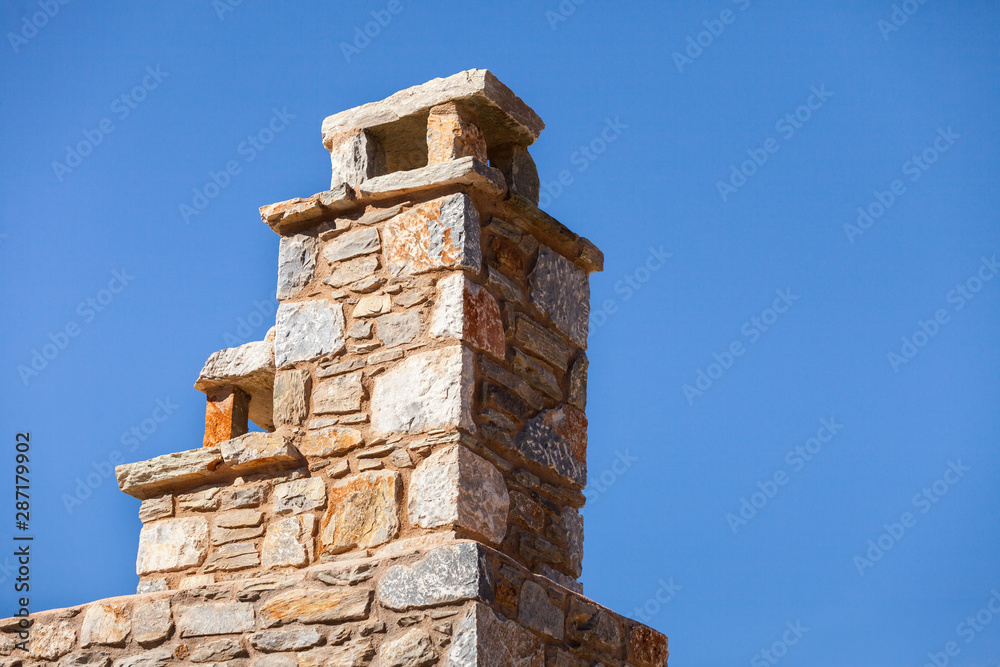 Stone amde chimney on roof
