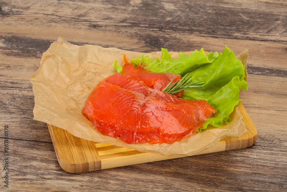 Sliced salmon fillet served rosemary Sliced salmon fillet served rosemary