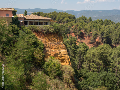 ROUSSILLON  France  august 2019  A view of the red ochre cliffs of Roussillon  ranked as one of the most beautiful villages of France