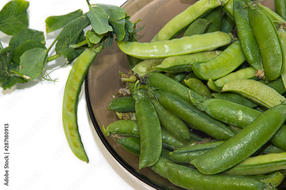 green peas isolated on a white background. healthy nutrition. fresh vegetables green peas isolated on a white background. healthy nutrition. fresh vegetables