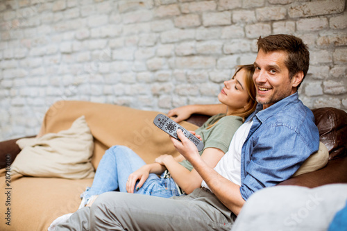 Smiling young couple relaxi...