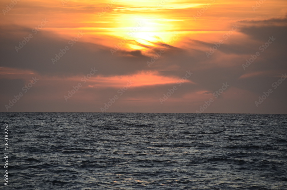 Nice orange sunset on calm ocean Nice orange sunset on calm ocean