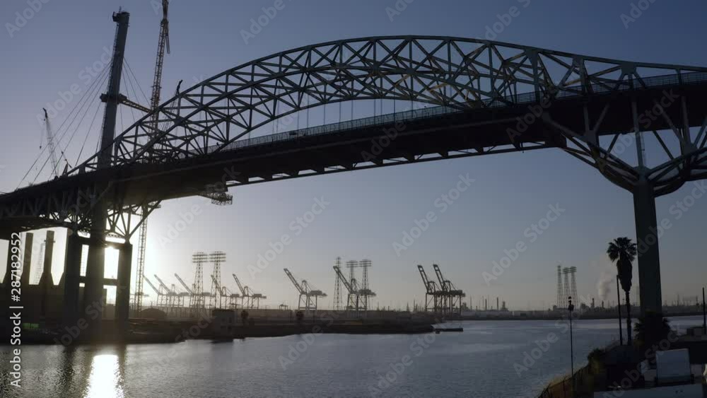 Aerial: Silhouette of Old Steel Bridge in Port of Los Angeles at Sunset - San Pedro, California Aerial: Silhouette of Old Steel Bridge in Port of Los Angeles at Sunset - San Pedro, California