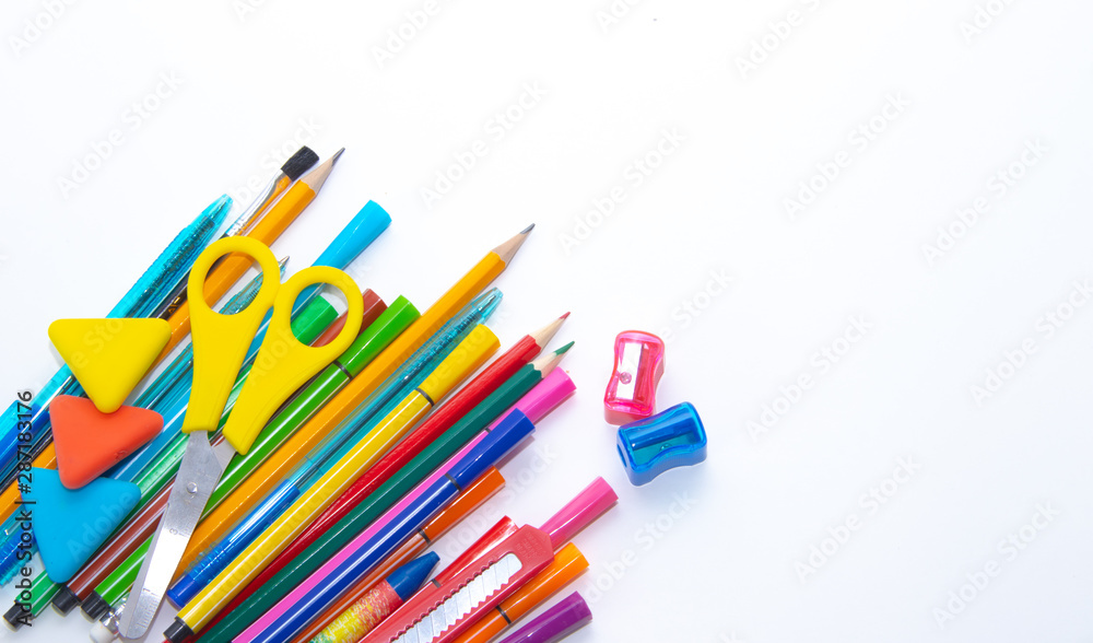 Fototapeta premium Felt-tip pens and pencils on a white background. Stationery layout. School theme. Preparing for school .Color school supplies isolated on white background. Study