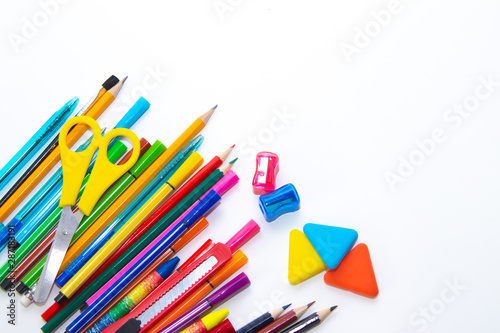 Felt-tip pens and pencils on a white background. Stationery layout. School theme. Preparing for school .Color school supplies isolated on white background. Study