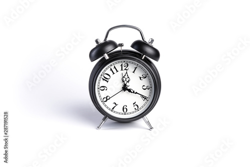 Old alarm clock isolated on white background