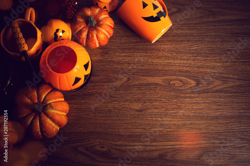 top view halloween party with pumpkin decoraation prop on wood table, holiday season greeting photo