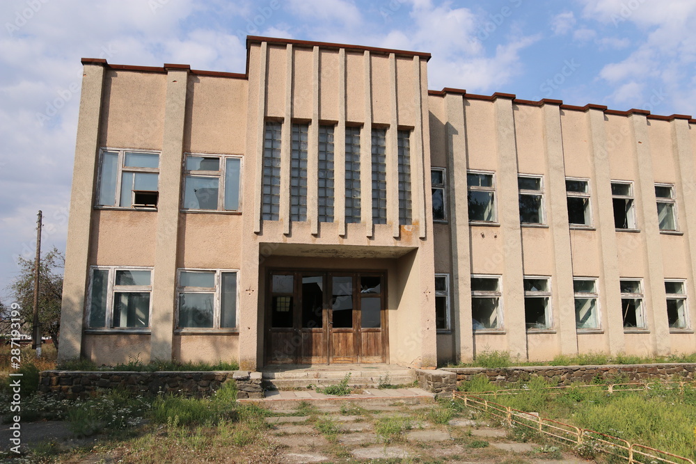 Old abandoned office building with broken windows