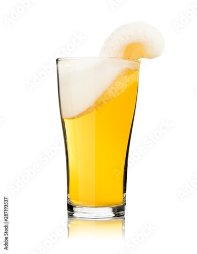 Beer in glass with froth foam splash isolated on white background stop motion celebration photo object design