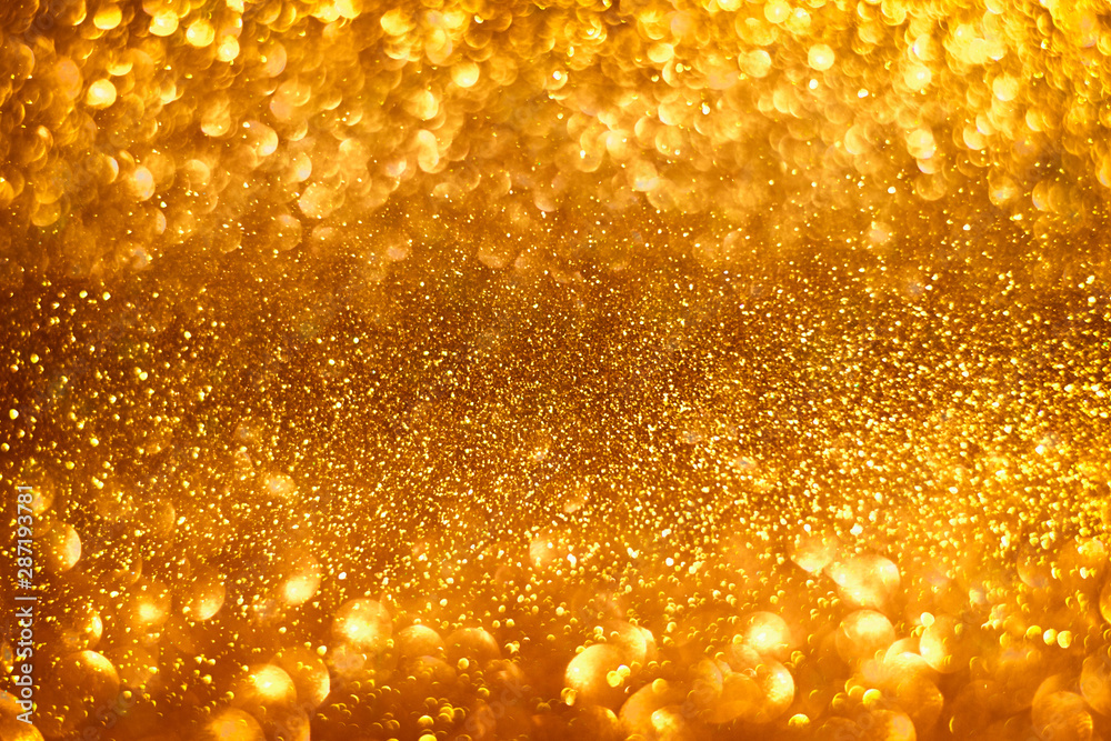 Abstract gold sparkles shiny defocused gold bokeh lights background use ...