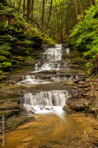 A little waterfall along a creek at the Waterman Conservation Education Center, Apalachin, in New York State, photographed at a slow shutter speed to show the motion of the water. 