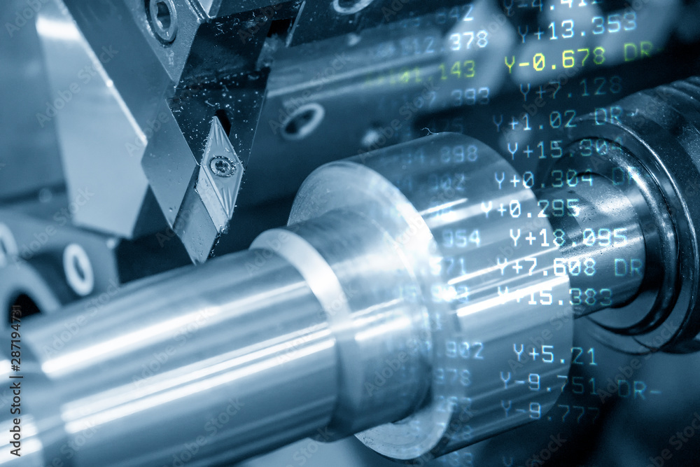 The abstract scene of G-code data and CNC lathe machine and cutting the metal rod by the chip cutting tool. The metal shaft rough cutting process by multi-tasking tuning centre in the closeup scene. The abstract scene of G-code data and CNC lathe machine and cutting the metal rod by the chip cutting tool. The metal shaft rough cutting process by multi-tasking tuning centre in the closeup scene.