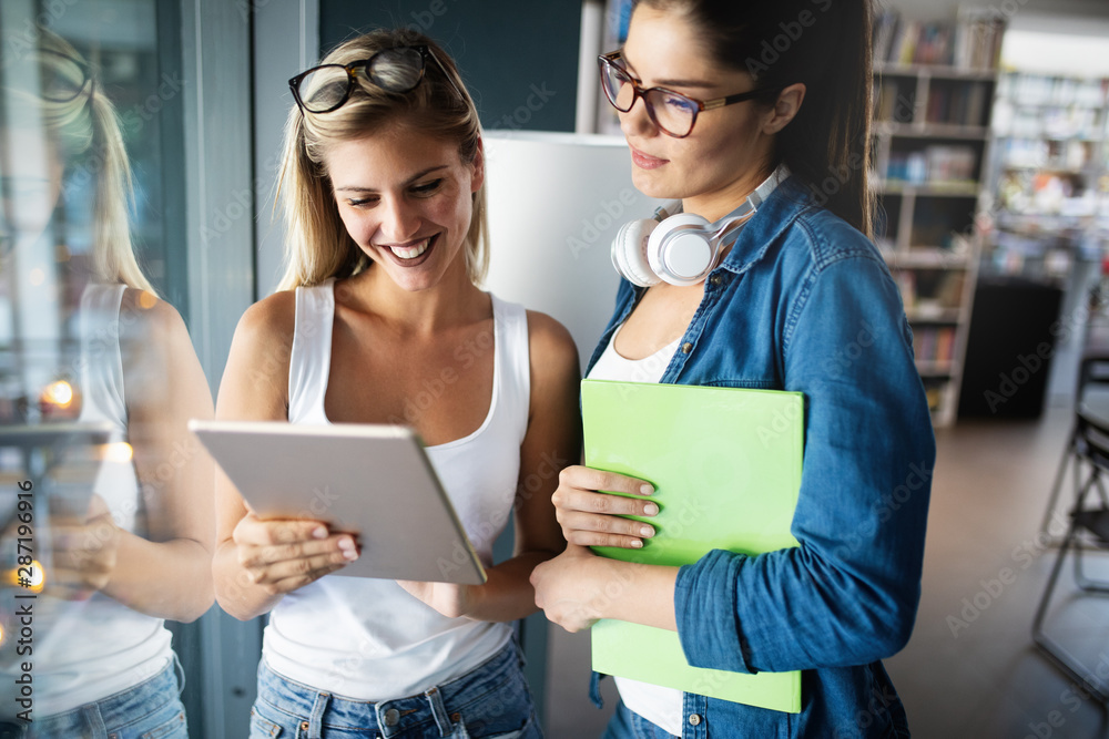 Group of college students studying and reading together. Education concepts Group of college students studying and reading together. Education concepts
