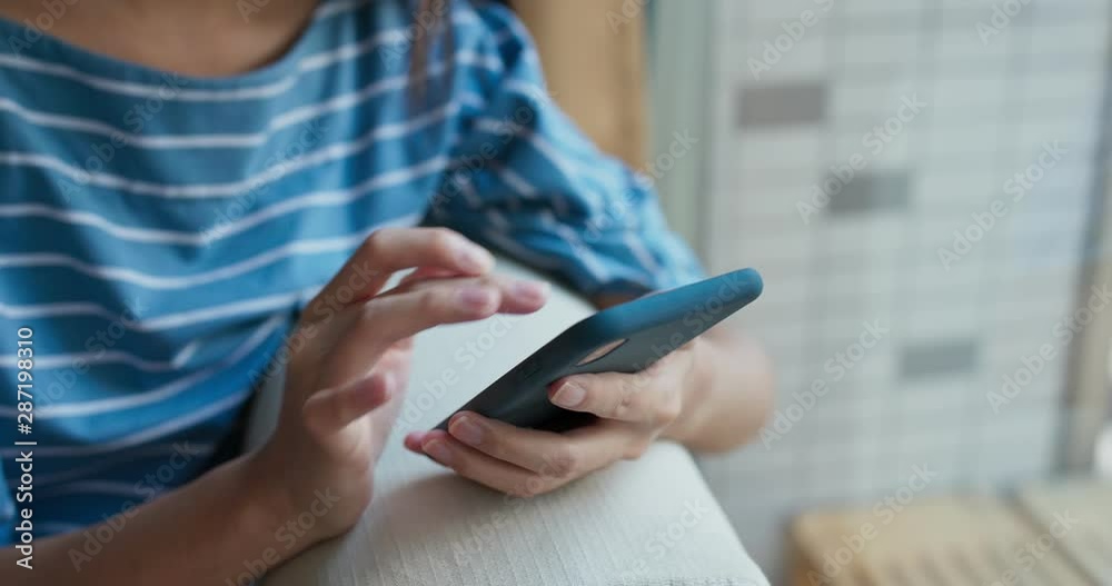 Woman use of cellphone at home Woman use of cellphone at home