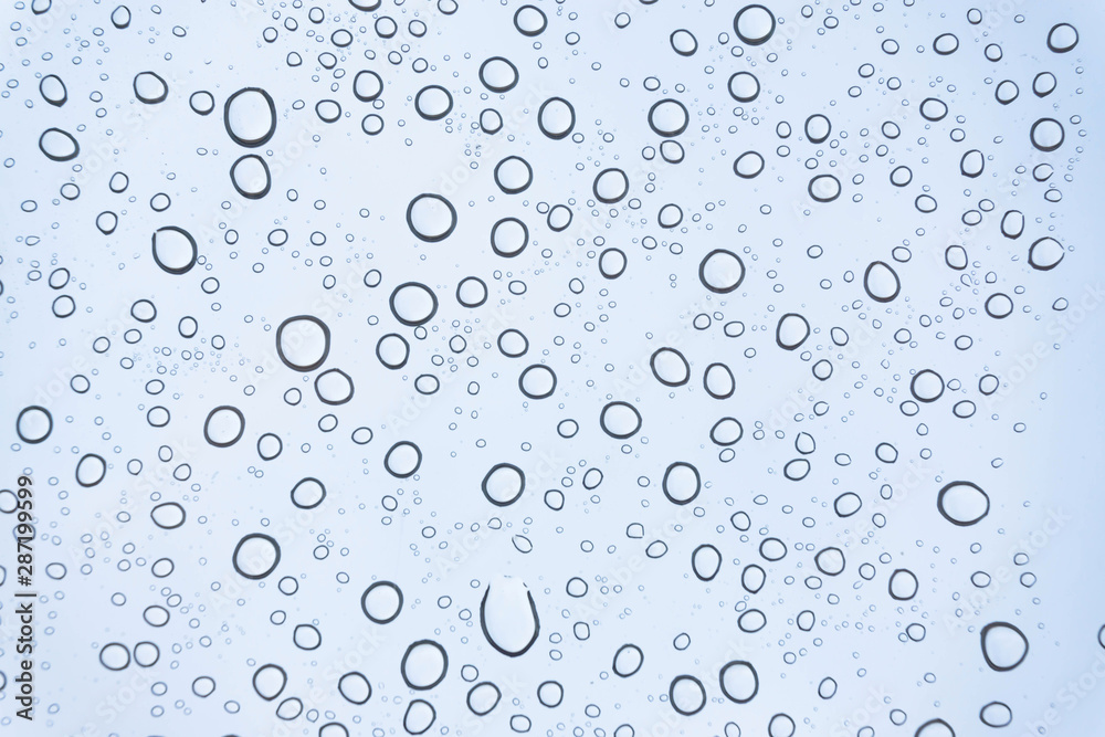 Blue Drops water drops on glass surface as background. Blue Drops water drops on glass surface as background.