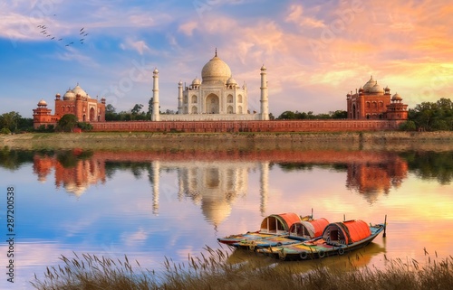 Obraz na płótnie Taj Mahal Agra on the banks of river Yamuna at sunset with moody sky and view of