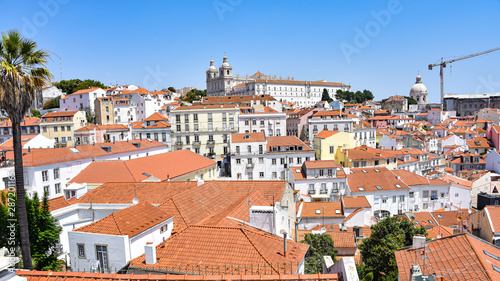 Lisbon, Portugal - July 23, 2019: Summertime views across the rooftops of the Alfama district