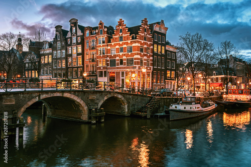 Beautiful canal houses on the corner of Brouwersgracht and Prinsengracht in the old center of Amsterdam during sunset