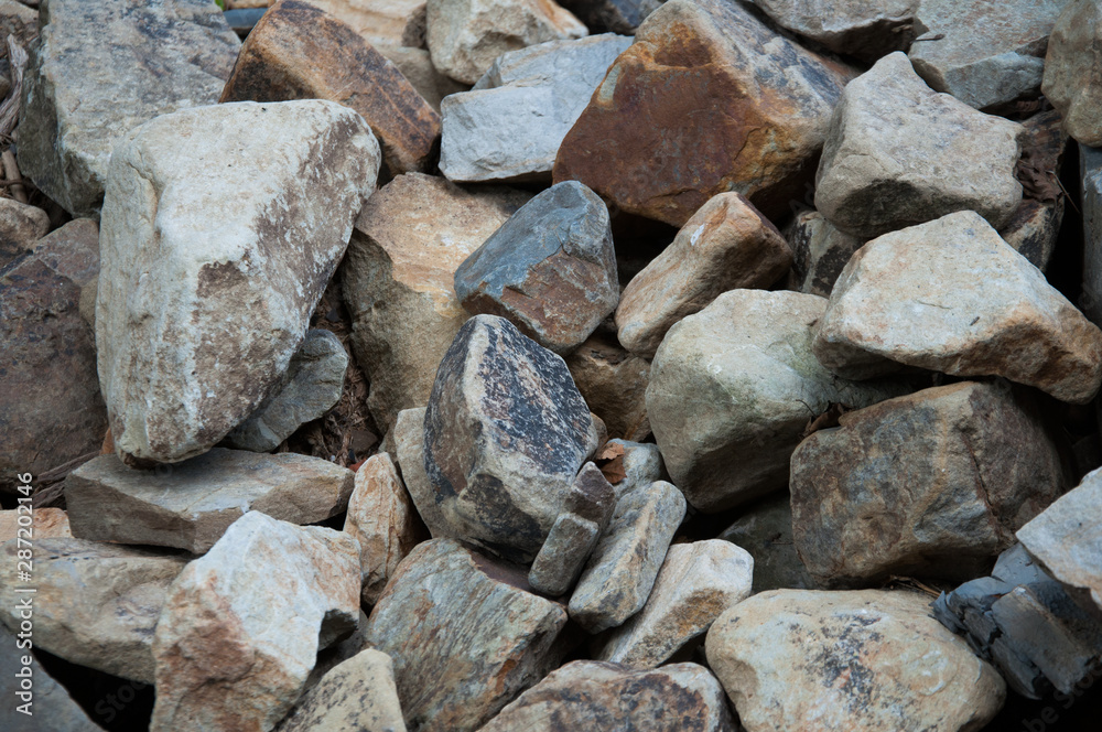 A lot of different stones. The texture of the stone. Background