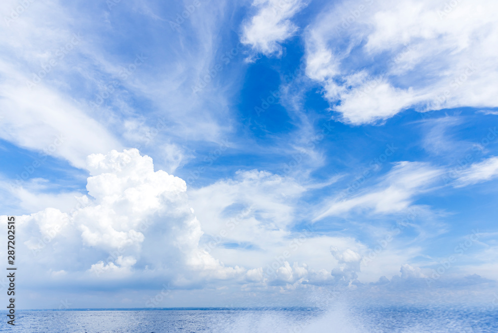 sky blue ocean water and blue sky with close up white fluffy tiny clouds background and pattern sky blue ocean water and blue sky with close up white fluffy tiny clouds background and pattern