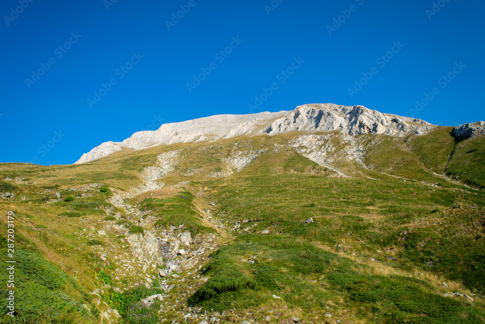 Path between Vihren hut and Vihren peak in Pirin national park, near Bansko, Bulgaria Path between Vihren hut and Vihren peak in Pirin national park, near Bansko, Bulgaria