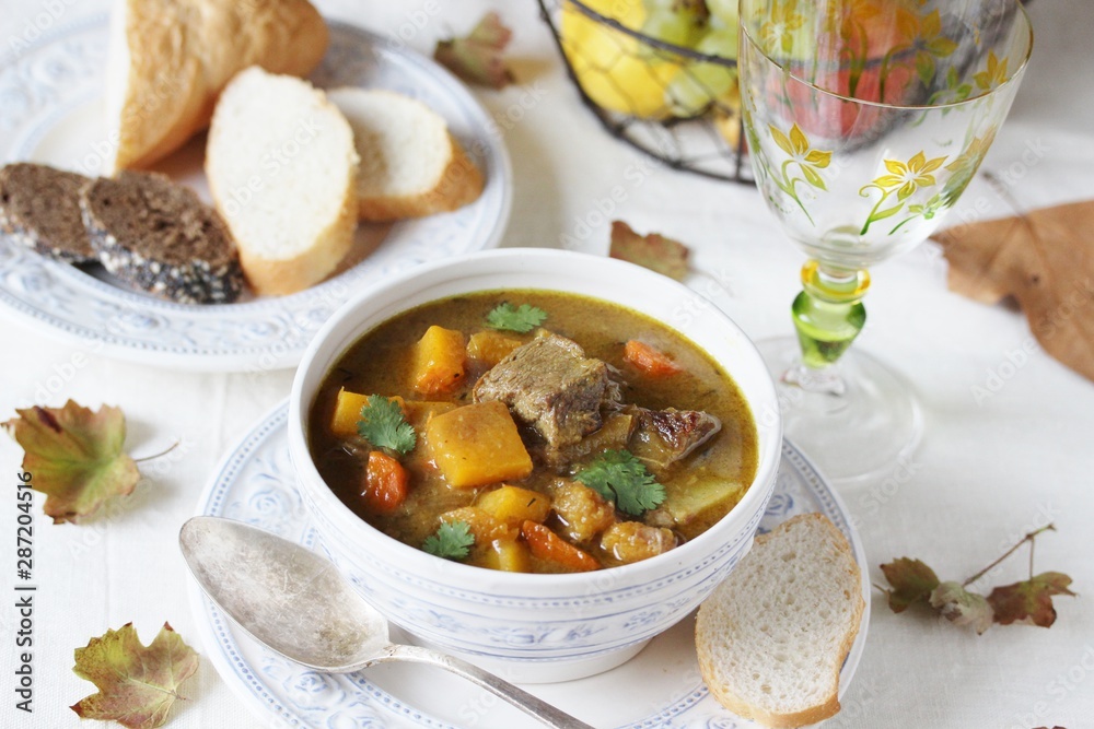 thick soup with pumpkin and beef. hearty autumn dish