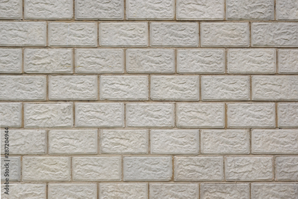 Naklejka premium Wall of the house made of concrete blocks. Background image. Image with reduced contrast
