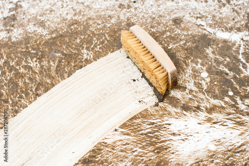 brush with cleaning mark in disgusting dirty bath photo