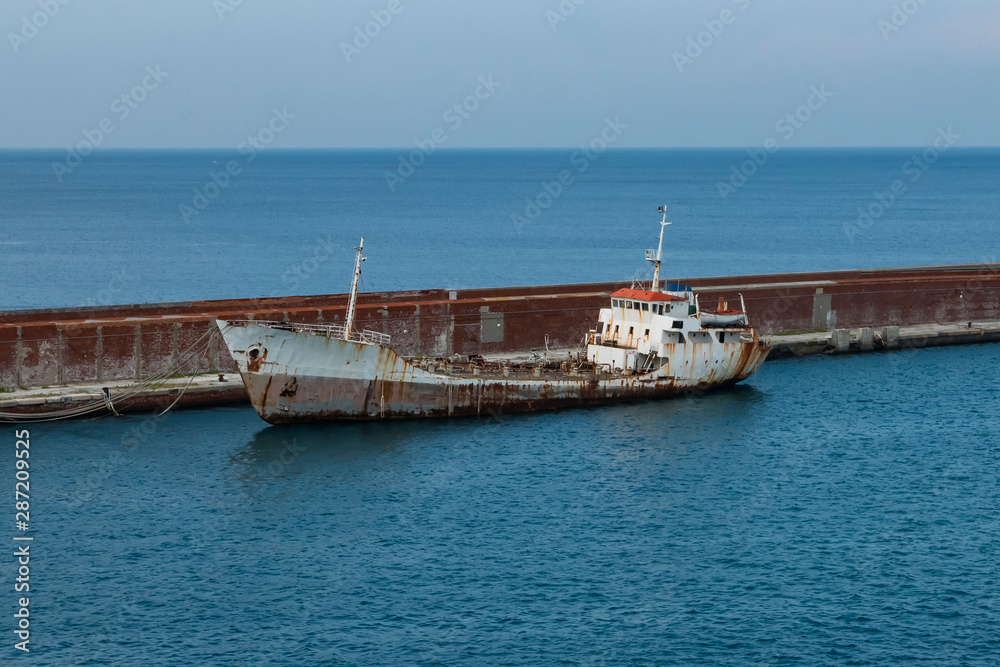 Wrecked ship in a dock