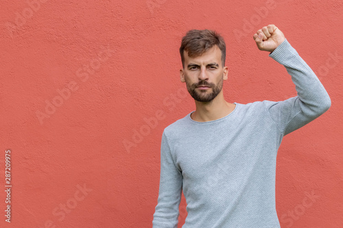Canvas Print Fist of guy arm raising up showing power strong