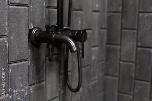 Wallpaper Mural shower mixer on rough dark grey brick wall Torontodigital.ca