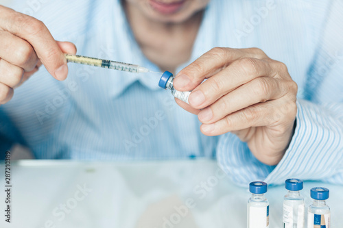 medical syringes for insulin for diabetes in woman hand.
