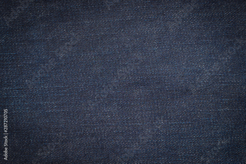 Macro, Close-up of texture details of denim blue jeans. Pattern of fabric or textile is abstract background. Concept design fashion and retro stlye.