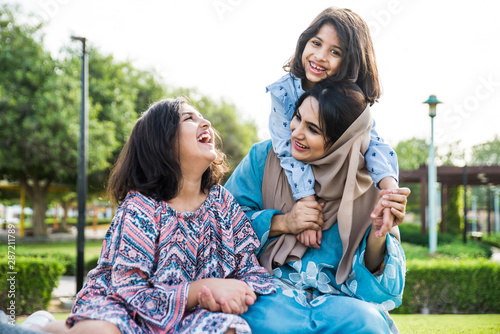 Photography Arabian family spending time in a park