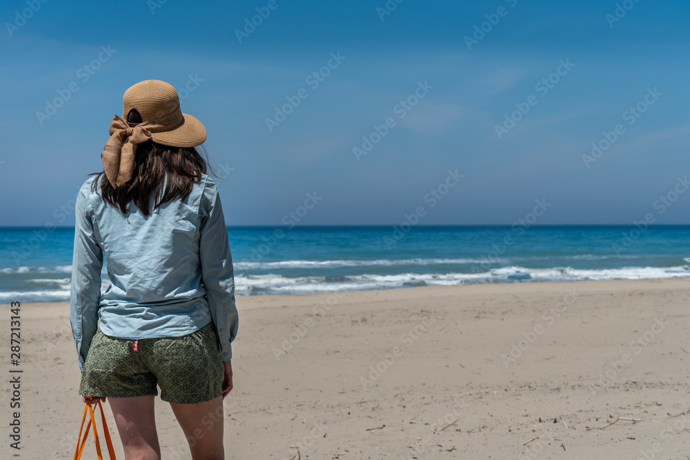 Girl Walking on sandy beach