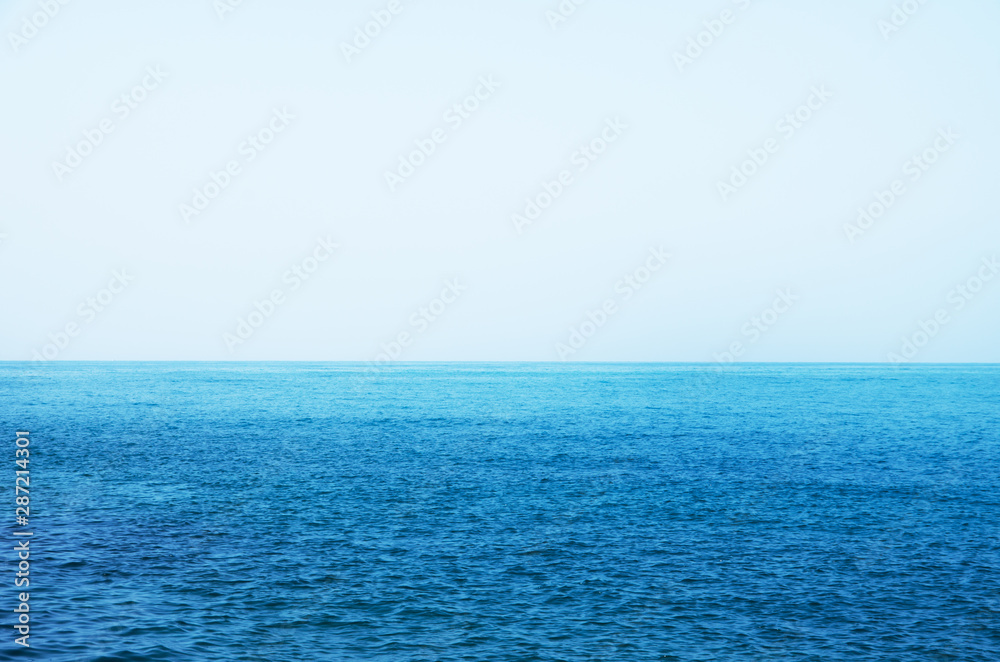 Blue sea with waves and clear blue sky