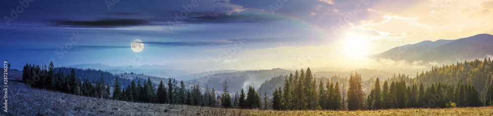 Naklejka premium day and night time change in mountains with forest on meadow. beautiful autumn weather. clouds and fog rising above the hills with row of spruce trees with sun and moon on the sky