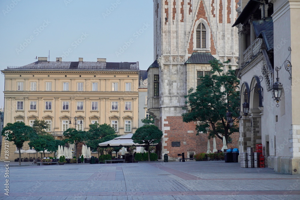old square with town hall and summer terrace at dawn waiting for tourists