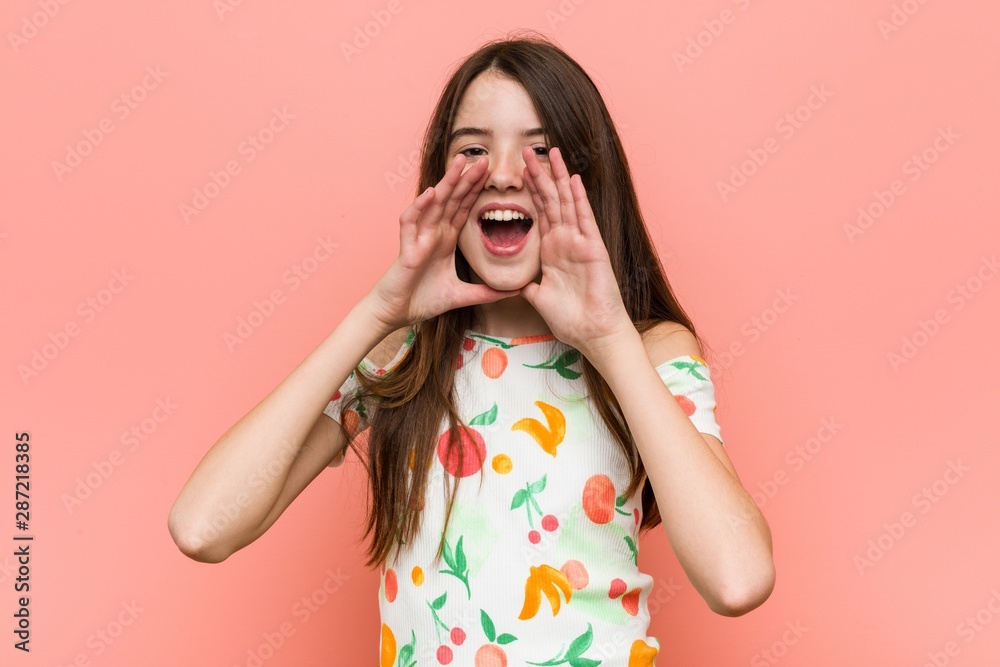 Girl wearing a summer clothes against a red wall shouting excited to front. Girl wearing a summer clothes against a red wall shouting excited to front.