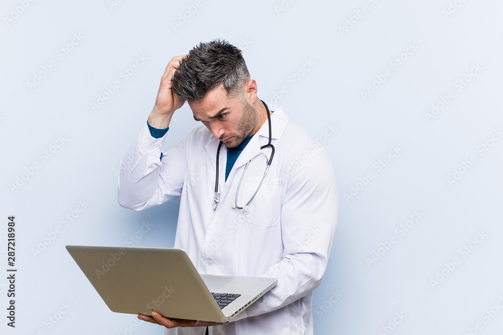 Caucasian doctor man holding a laptop being shocked, she has remembered important meeting. Caucasian doctor man holding a laptop being shocked, she has remembered important meeting.