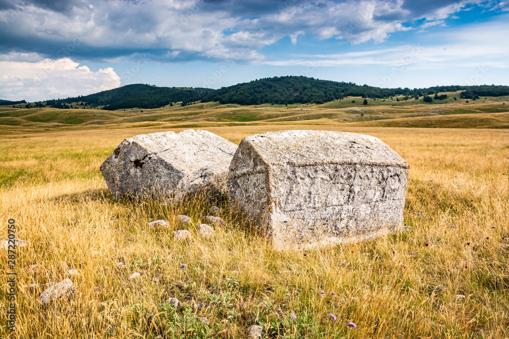 Old tombstones - Stecci Bosanskih bogumila - near Vrdolje on the way to Lukomir, Bosnia and Herzegovina Old tombstones - Stecci Bosanskih bogumila - near Vrdolje on the way to Lukomir, Bosnia and Herzegovina