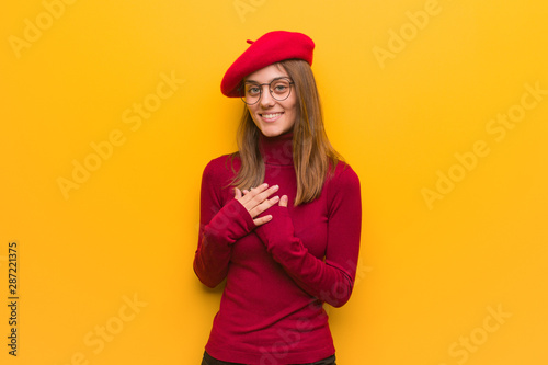 Young french artist woman doing a romantic gesture